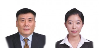 A photo of Li Dongming who is a partner and Yang Lu who is a trainee lawyer at East & Concord Partners