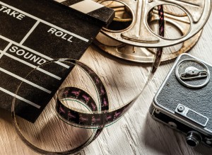 Vintage_film_reel,_camera_and_director_board