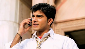 Indian_man_using_mobile_phone